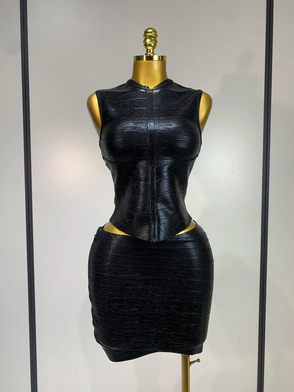 Black mock neck sleeveless top and mini skirt set
