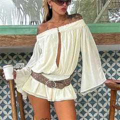 Model wearing an off shoulder keyhole front romper with bell sleeves