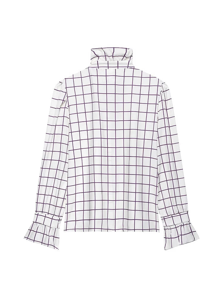 Black and white checkered blouse on a white background
