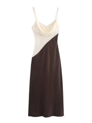 Two-tone dress with cream top and brown skirt on a white background