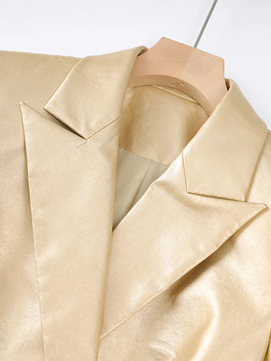 Close-up of a beige satin garment on a mannequin with a white background
