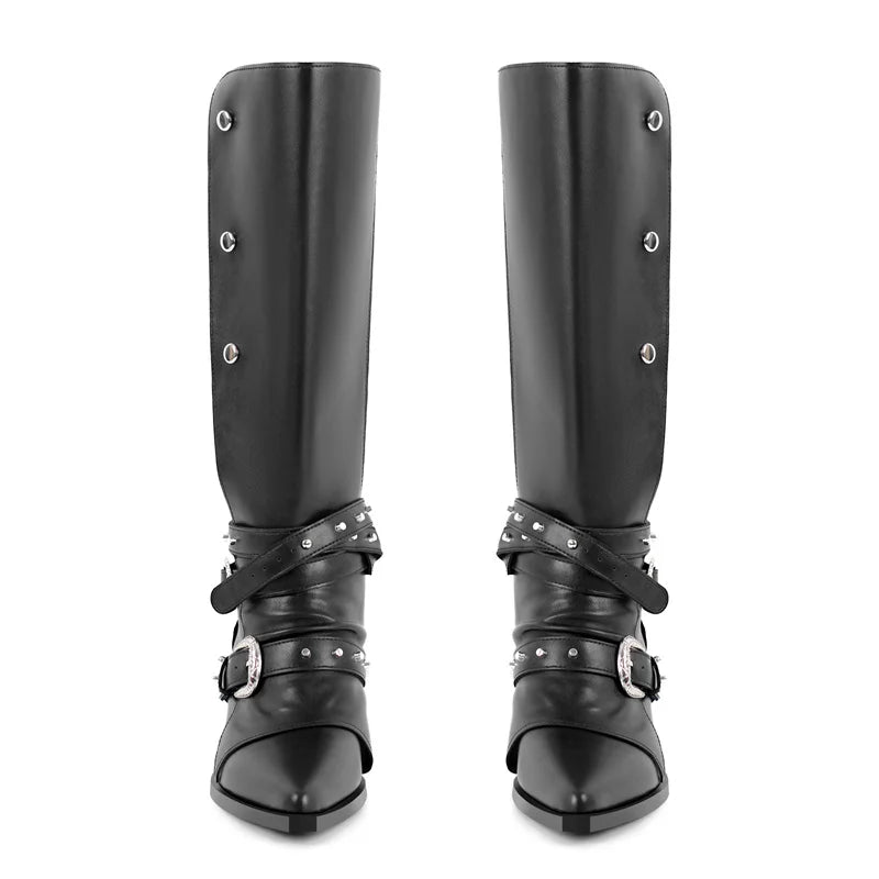 Front view of black pointed toe knee high boots with metal rivet and buckle details.