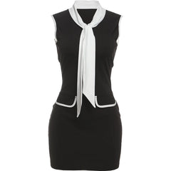 Black dress with white accents on a white background