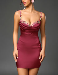 Red dress with floral straps on a gray background