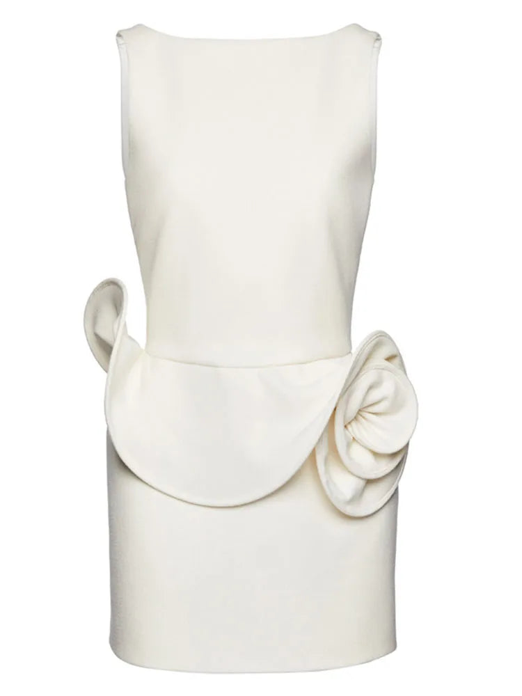 White sleeveless dress with a floral detail on a white background