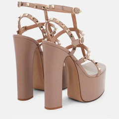Beige high-heeled platform sandals with studded details
