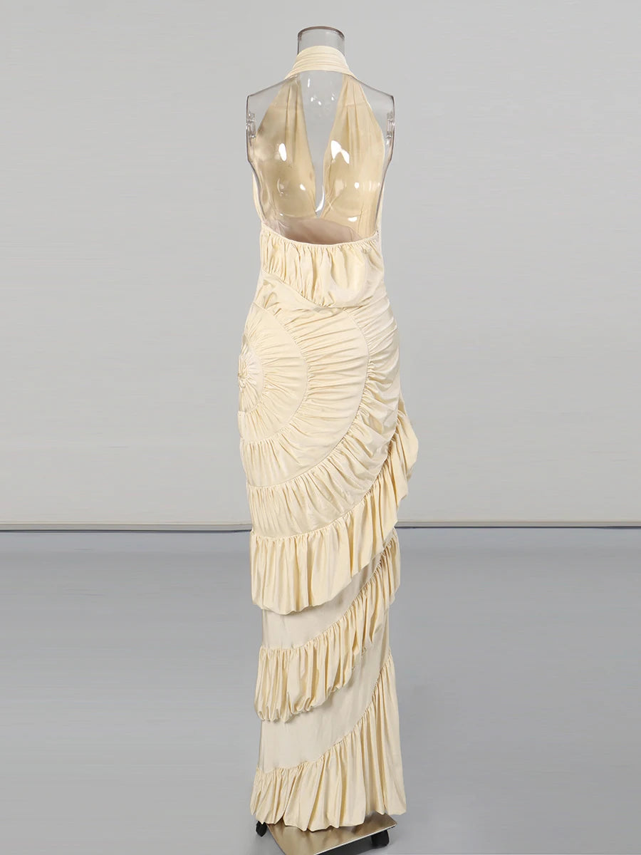 Beige evening gown on a mannequin against a gray background