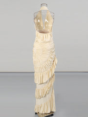 Beige evening gown on a mannequin against a gray background