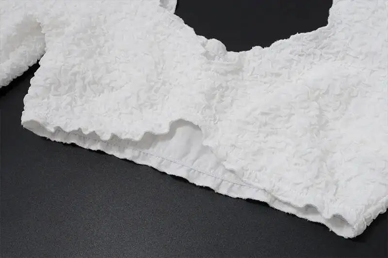 Close-up of a textured white fabric on a black background