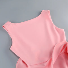 Pink sleeveless top on a gray background