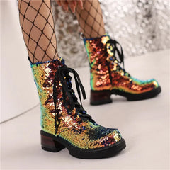 Multicolored sequin boots with fishnet stockings on a neutral background