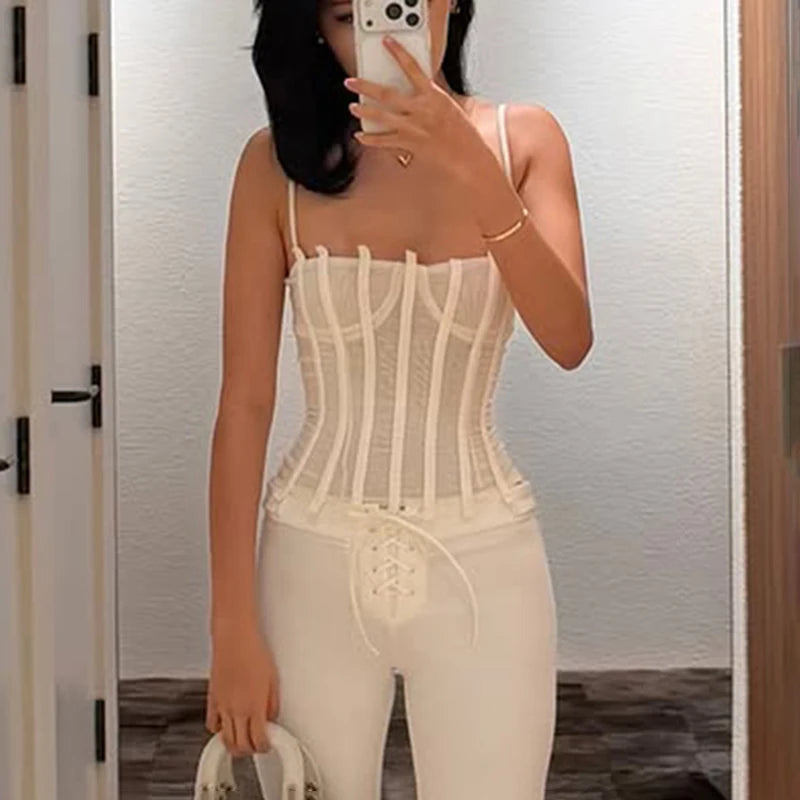 Model wearing white strappy boned corset top
