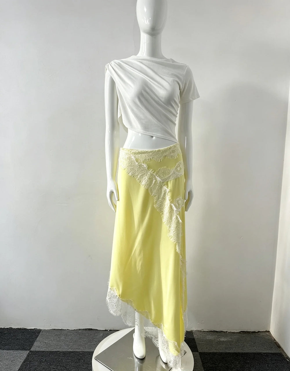 Yellow variant of cutout lace trim asymmetrical dress on mannequin