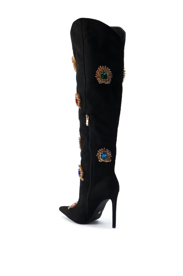Black knee-high boot with decorative embellishments