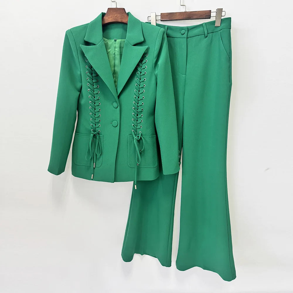 Green lace-up blazer and flared pants suit displayed on hangers