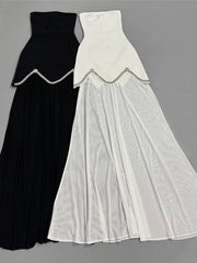 Black and white strapless top and maxi skirt two-piece sets laid flat