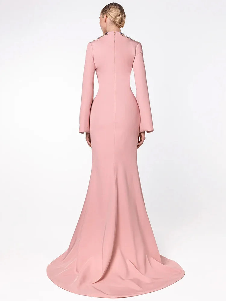 Back view of pink buttoned v-neck maxi dress with bell sleeves