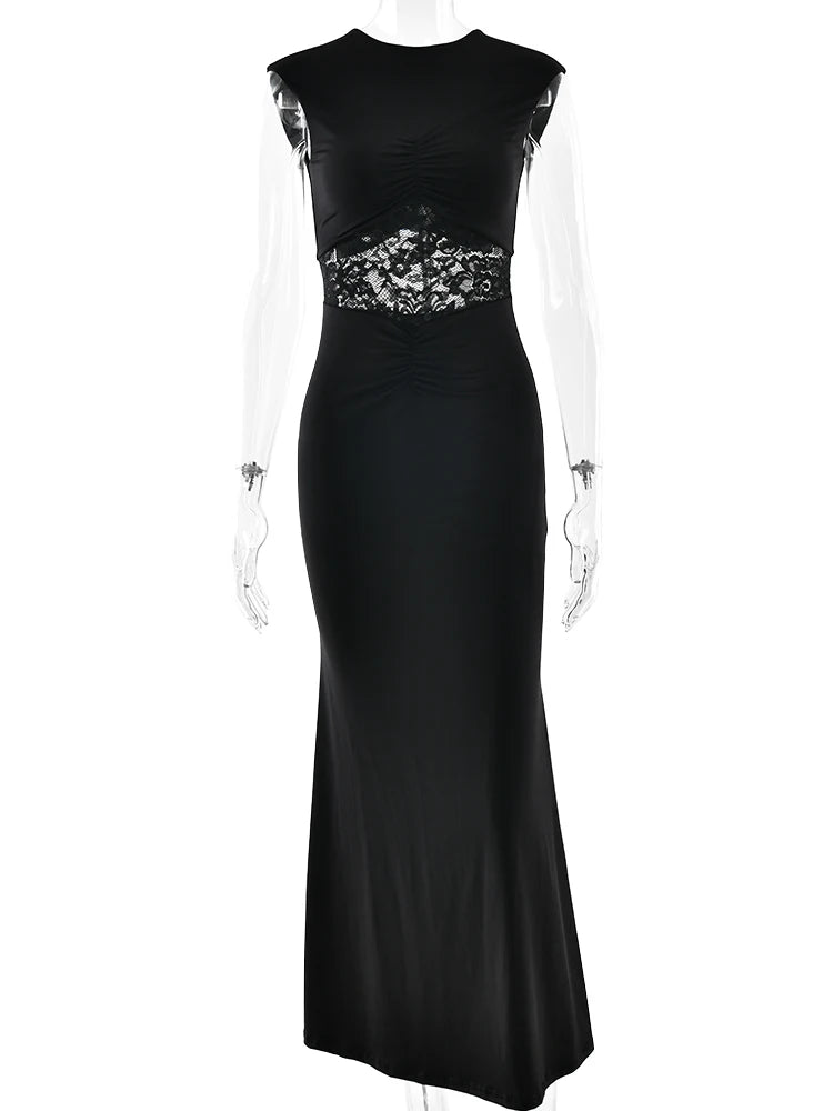 Black evening gown with floral embellishments on a white background