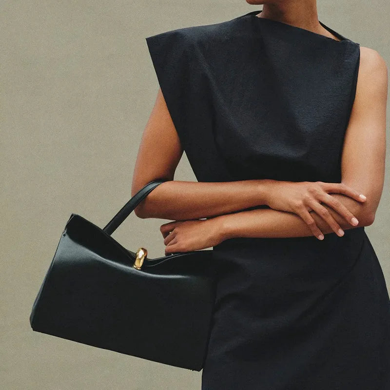 Model wearing a black shoulder bag