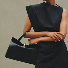 Model wearing a black shoulder bag