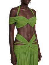 Green halter neck ruched crop top with off-shoulder sleeves and a high-waist cutout midi skirt