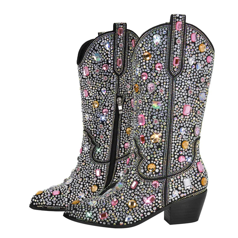 Decorative cowboy boots with colorful gemstones on a white background