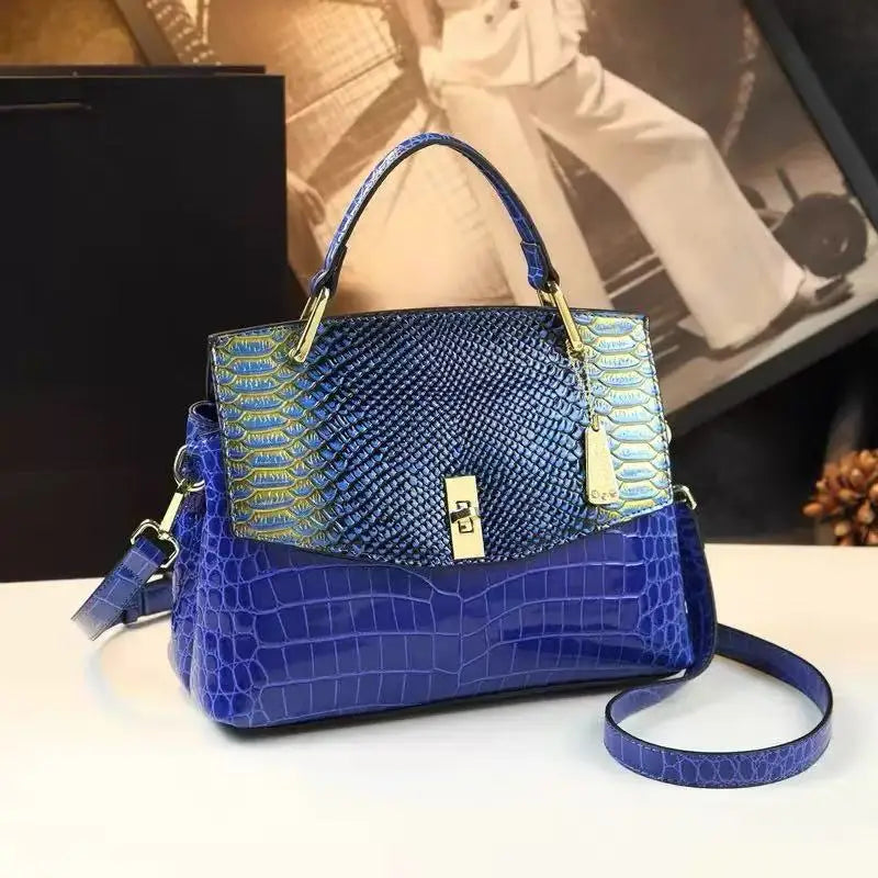 Blue embossed leather satchel bag with snake print flap