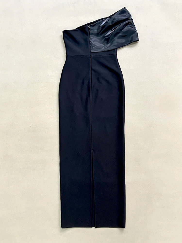 Navy blue off-shoulder dress on a beige background