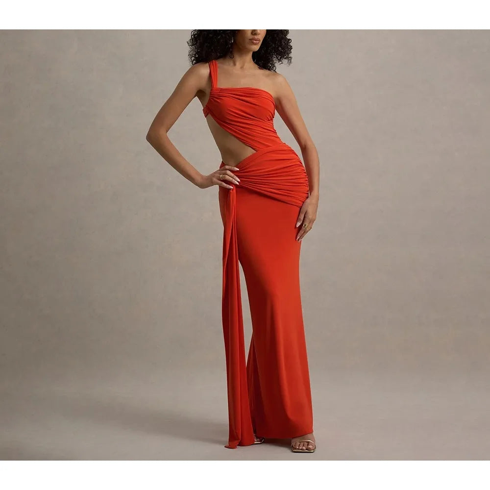 Red evening gown with cut-out design on a neutral background