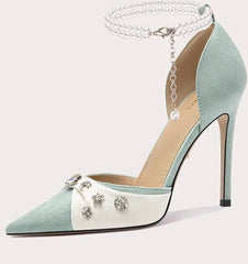 High-heeled shoe with decorative elements on a white background