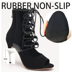 Black high-heeled shoes with lace-up design and non-slip rubber sole on a white background.