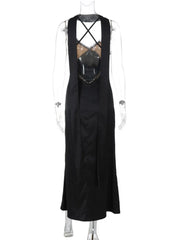 Black sleeveless dress with criss-cross straps on a mannequin against a white background