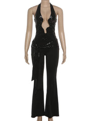 Black sequin jumpsuit on a mannequin against a white background