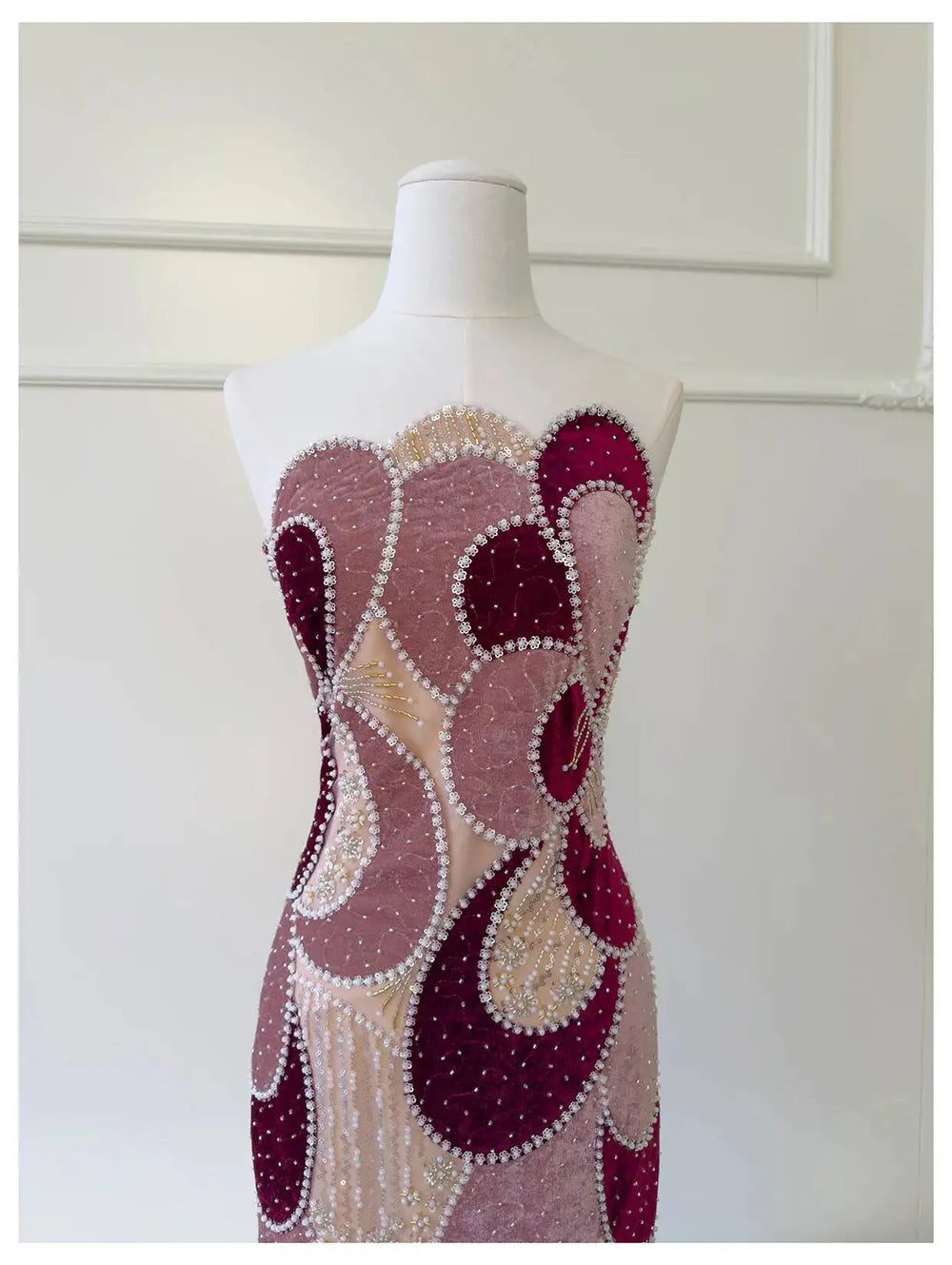 Close-up of velvet color-blocked beaded column dress bodice