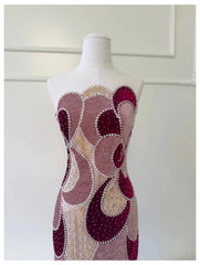 Close-up of velvet color-blocked beaded column dress bodice