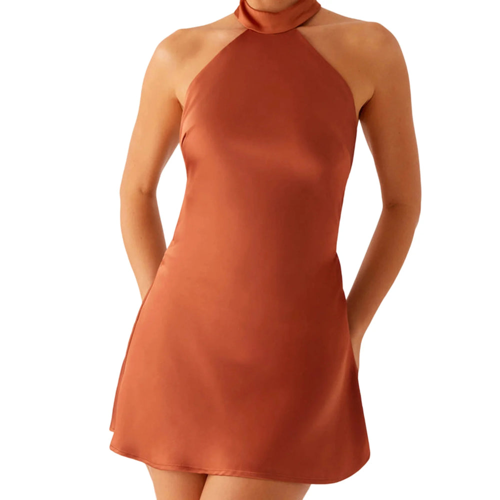 Orange halter neck dress on a white background