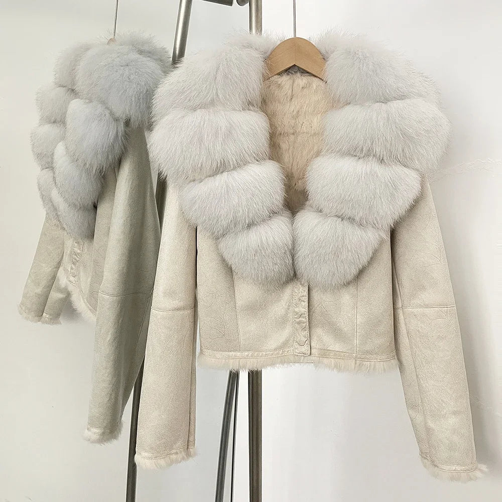 Beige jacket with fur accents on a rack against a white background