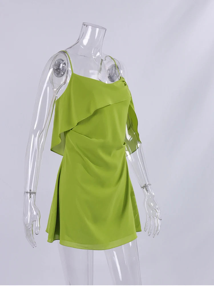 Green dress on a mannequin against a white background
