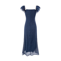 Back view of a blue polka dot midi dress with a square neckline and ruffled sleeves.