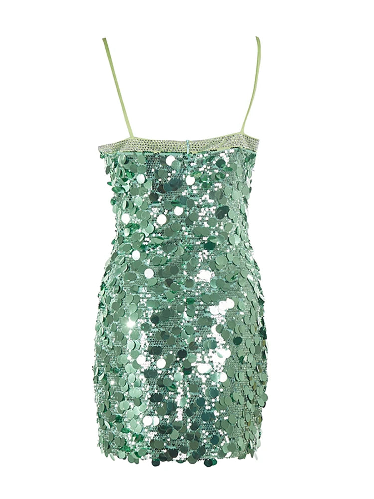 Green sequin dress with thin straps on a white background