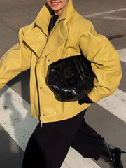 Model wearing yellow stand collar drawstring jacket