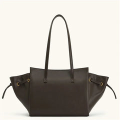 Brown leather tote bag with drawstring on a white background