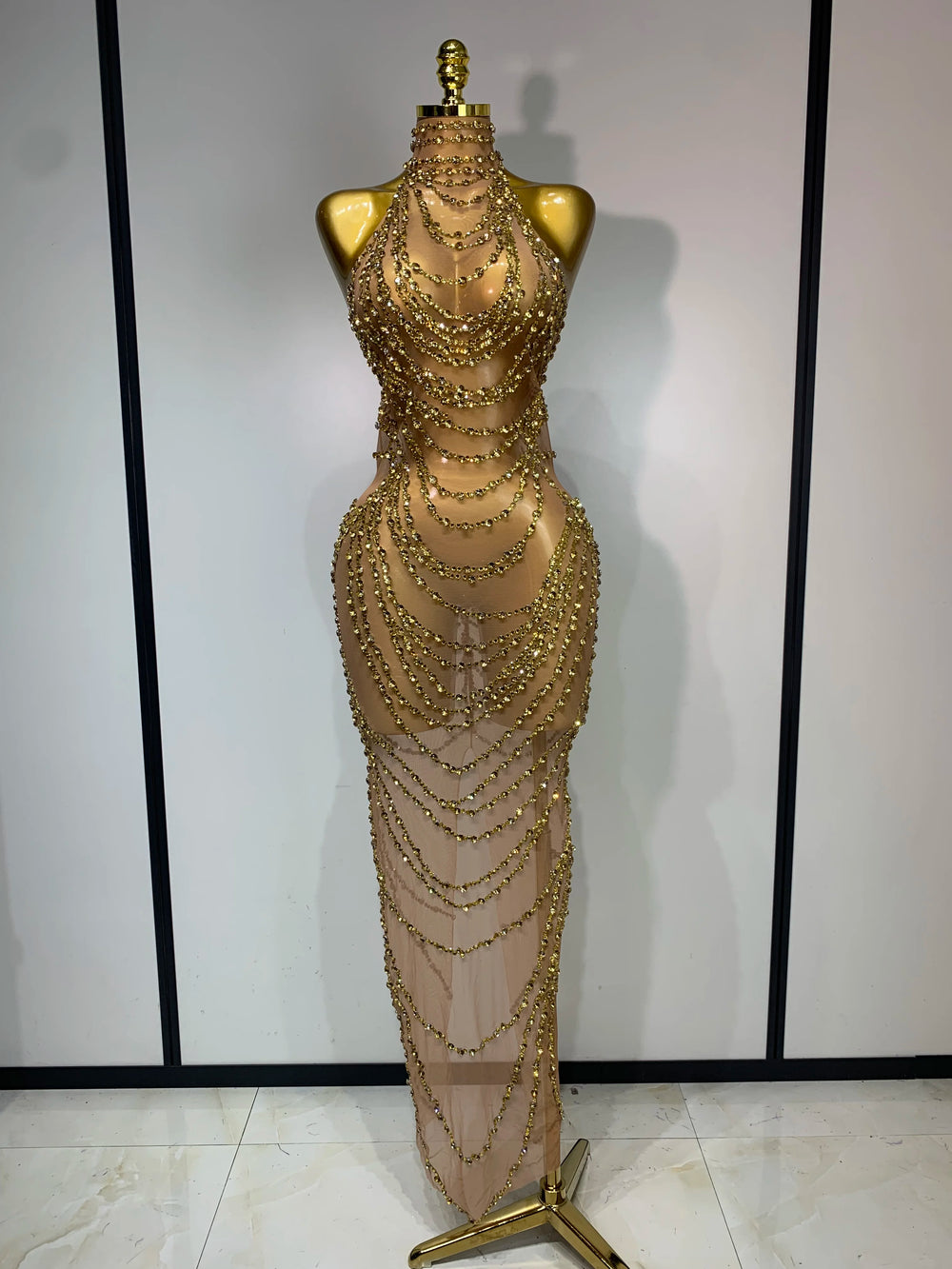 Chain embellished halter gown with gold beads