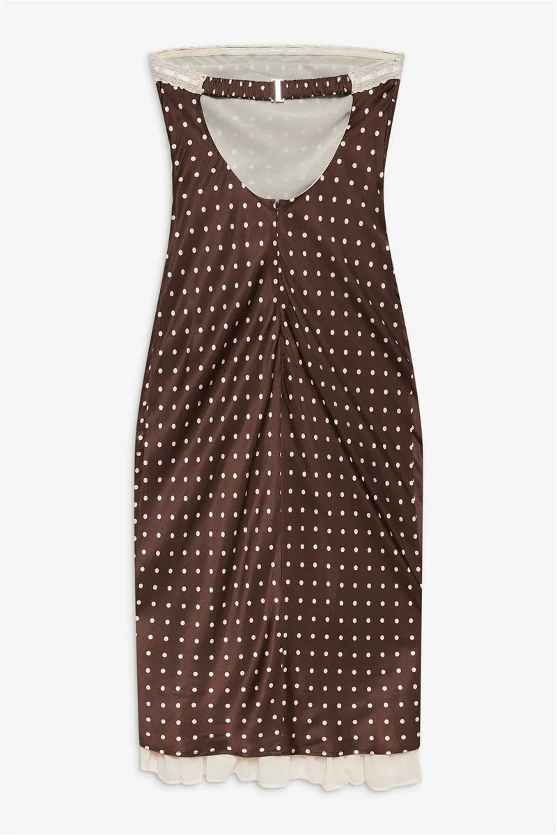 Brown polka dot dress with white trim on a white background
