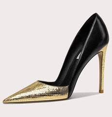 Black and gold high-heeled shoe on a light gray background