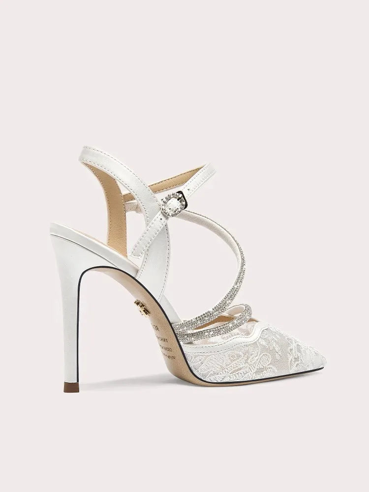 White high-heeled shoe with lace details on a light pink background