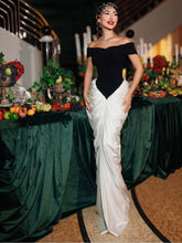 Woman wearing contrast black and white gown at formal event