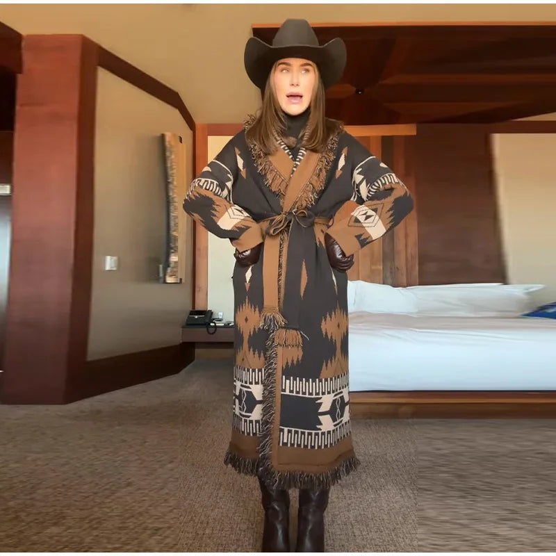 Person wearing a patterned robe and cowboy hat in a bedroom setting