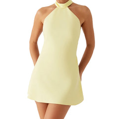 Light yellow halter neck dress on a white background