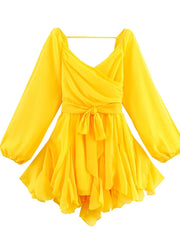 Yellow dress with long sleeves on a white background